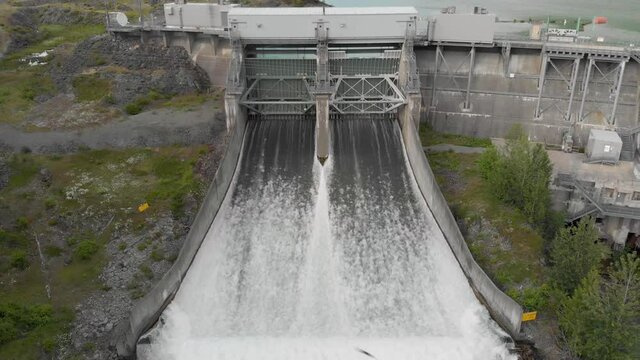 A hydroelectric dam next to a mountain lake in Whistler, BC. 24FPS 4K.