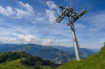 Cable car mast with a view of the Alps