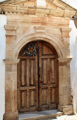Wooden door of a traditional house in Lindos village, Rhodes, Greece