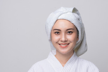 Obraz premium Portrait Asian woman smiling in spa dress in studio grey background, Beautiful girl healthcare.