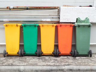 Different colored recycle garbage trash Bins at Sidewalk. Old Recycling Garbage for Environment.