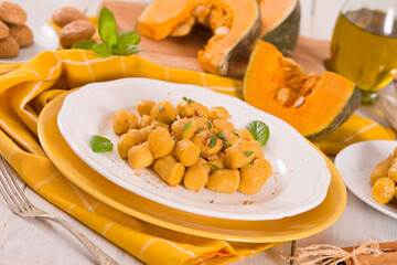Pumpkin gnocchi with grated amaretti cookies.	
