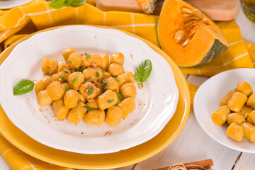 Pumpkin gnocchi with grated amaretti cookies.	
