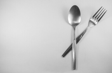 fork and spoon on white background