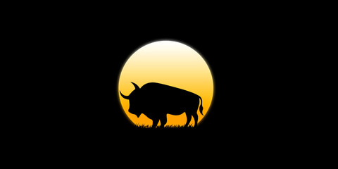 The bull walks in the dark moonlight in the dark