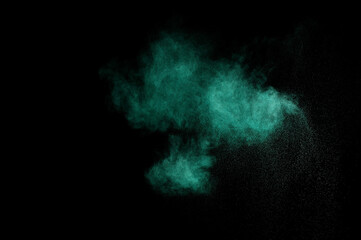 Aquamarine powder explosion on black background. Colored powder cloud. Colorful dust explode. Paint  Holi.