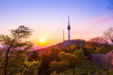 Seoul tower in sunset and old wall on namsan mountain, south korea.