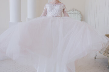 bride in a wedding dress in a bright room
