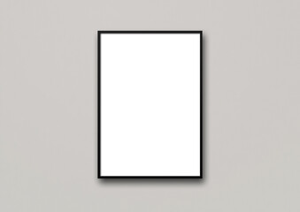 Black picture frame hanging on a light grey wall