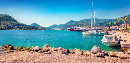 Fototapeta premium Panoramic morning view of port Nydri. Stunning spring seascape of Ionian Sea. Bright outdoor scene of Lefkada island, Greece, Europe. Traveling concept background.
