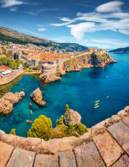Aerial view of Old Town from Fort Bokar. Picturesque morning cityscape of Dubrovnik. Sunny summer seascape of Adriatic sea, Croatia, Europe. Beautiful world of Mediterranean countries. © Andrew Mayovskyy