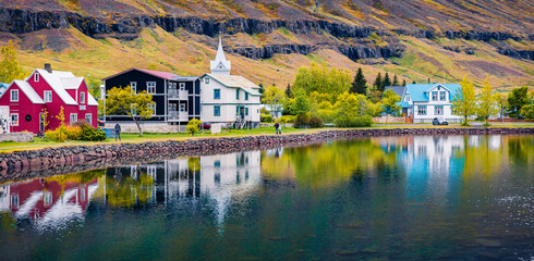 Fototapeta premium Panoramic morning cityscape of small fishing town - Seydisfjordur. Wonderful summer scene of east west Iceland, Europe. Traveling concept background.