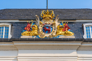 Coat of arms decoration in Rococo style  on the roof of the Old Town Hall building in Market Square...