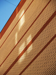 Bricks wall with square shadows