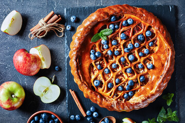 Apple Blueberry Pie on a black slate plate