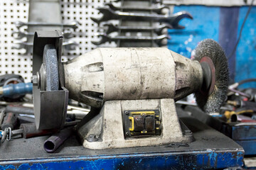 motorized sanding tool in garage