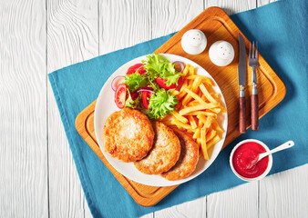 turkey burgers served with salad and fries
