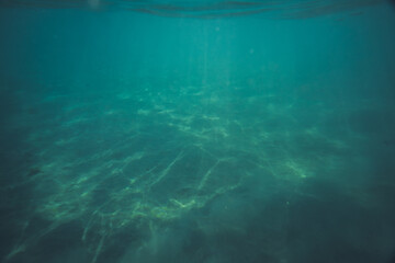 Underwater in ocean light reflections.