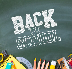 School supplies on blackboard. Back to school concept..