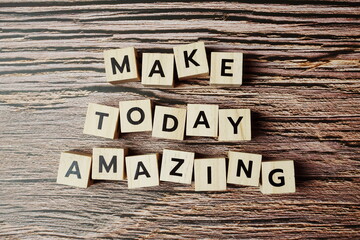 Make Today Amazing alphabet letter on wooden background