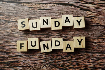 Sunday Funday alphabet letter on wooden background