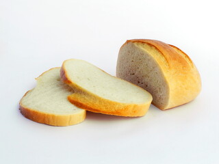 A loaf of white bread, sliced. White isolated background.