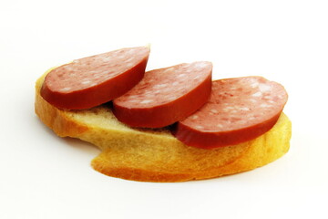 Sandwich with salami sausage on white isolated background