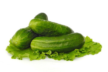 Cucumbers and salad on white isolated background