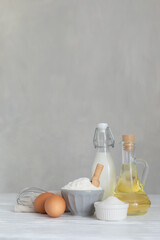 Ingredients for bakery butter flour, milk, oil, eggs, sugar, kitchen accessories