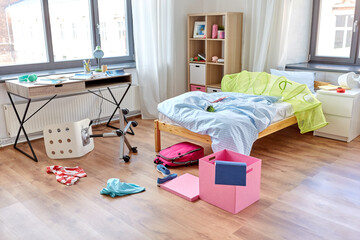 mess, disorder and interior concept - view of messy home kid's room with scattered stuff