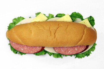 Long sandwich with pepperoni, cheese and herbs. View from above. Isolate on white.