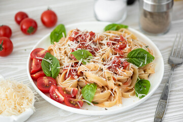 fettuccine with tomato sauce, parmesan and basil