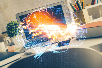 Double exposure of work space with computer and human brain drawing hologram. Brainstorm concept.