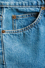Blue denim Jeans pocket texture background closeup