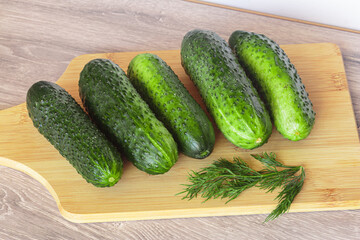 Fresh cucumbers on a cutting board. Fresh produce from the Farmers Market.