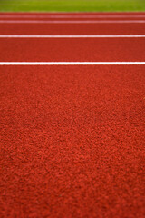Red stadium running track closeup