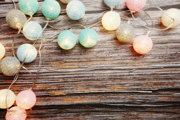Colorful LED cotton ball decorative on woode background