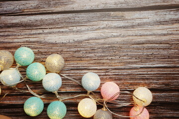 Colorful LED cotton ball decorative on woode background