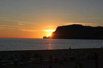 Alanya, TURKEY - August 10, 2013: Travel to Turkey. Beaches on the Mediterranean coast. The sun is...