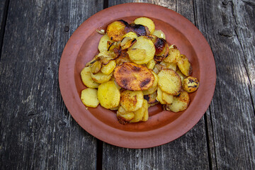 fried potatoes with onions and garlic. popular Russian dish