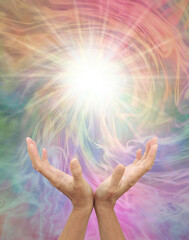 Connecting to Higher Dimensional Power for Inspiration - female open hands reaching up to a bright...