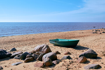 Boat in daylight at Baltic sea shore in Tuja, Latvia