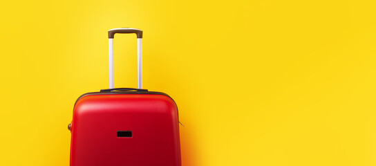red travel suitcase close up over yellow background, panoramic mock-up image with space for text