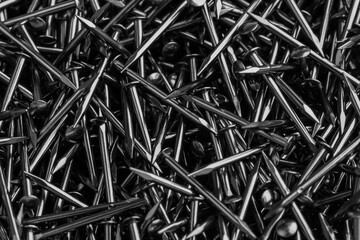 Abstract background of many small shiny nails for footwear production