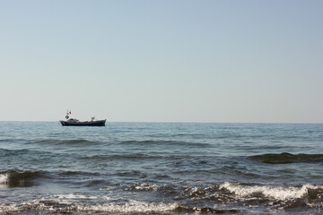 Alanya, TURKEY - August 10, 2013: Travel to Turkey. Beaches on the sea. Waves on the Mediterranean coast.