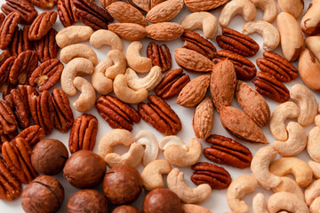 Background of mix nuts pecan, macadamia, walnut, almonds, hazelnuts Top view, flat lay