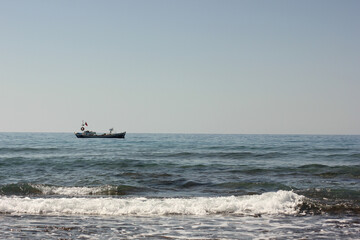 Alanya, TURKEY - August 10, 2013: Travel to Turkey. Beaches on the sea. Waves on the Mediterranean coast.
