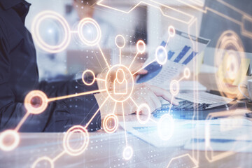 Social network theme hologram with businessman working on computer on background. Multi exposure.