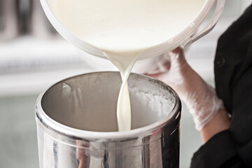 Filling healthy fresh milk - making of ice cream