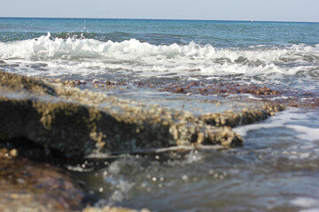 Alanya, TURKEY - August 10, 2013: Travel to Turkey. Beaches on the sea. Waves on the Mediterranean coast.